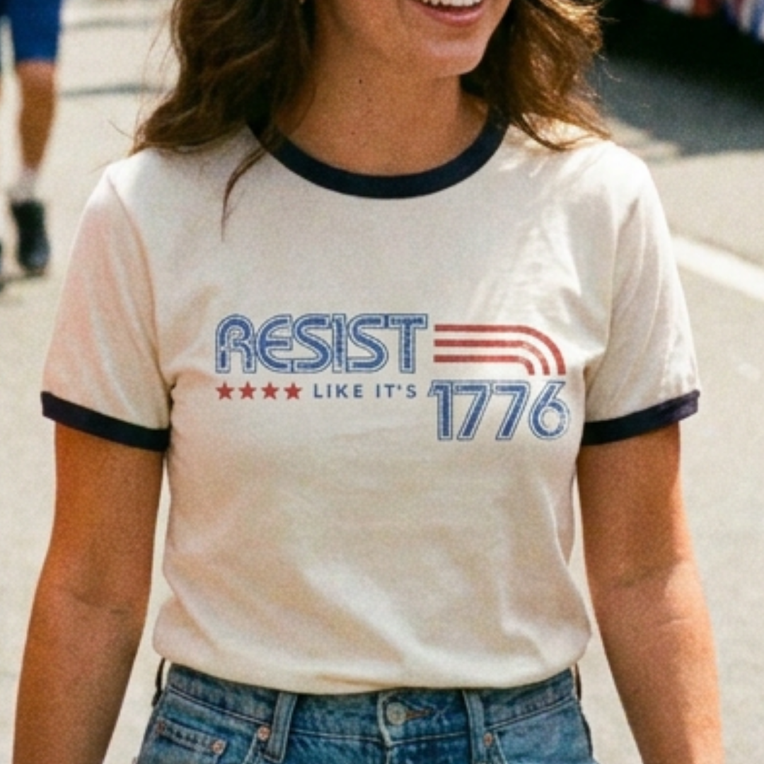 Woman wearing a t-shirt with 'Resist Like It's 1776' text and design.