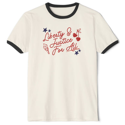 An off-white ringer t-shirt with black trim on the collar and sleeves, featuring a red and blue graphic on the chest that reads 'Liberty & Justice For All' with stars, cherries, and a torch.