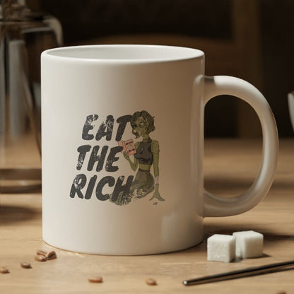 White mug with a skull wearing a cowboy hat and holding a coffee cup design, placed on a wooden table with coffee beans and a jar of coffee.