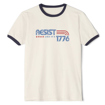 White t-shirt with 'RESIST LIKE IT'S 1776' text on a white background