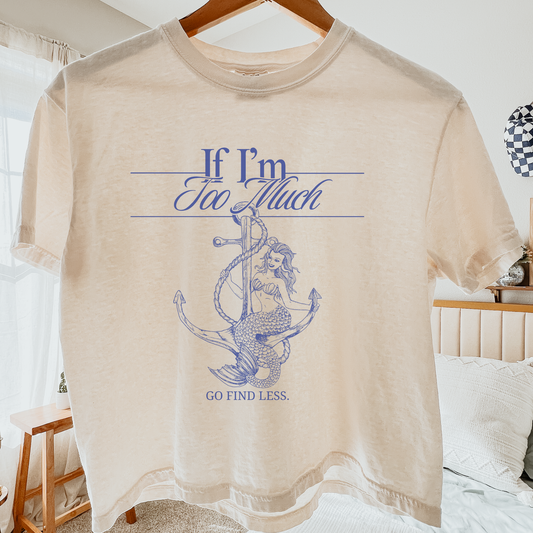 If I'm Too Much, Go Find Less feminist crop top featuring a bold empowering quote on a soft graphic crop tee.