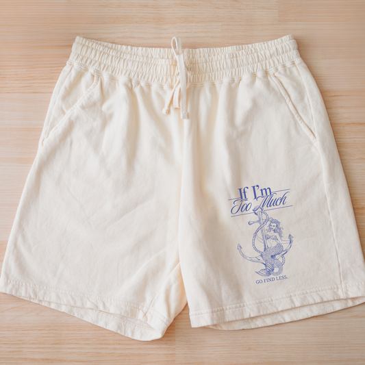 If I'm Too Much, Go Find Less feminist fleece sweat shorts with a relaxed fit, drawstring waist, side pockets, and empowering graphic quote.