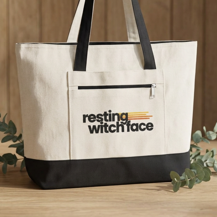 Resting Witch Face canvas tote bag featuring funny feminist witch artwork with roomy zippered storage for books, shopping, and everyday use.