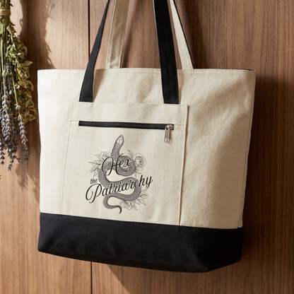 Hex the Patriarchy feminist canvas tote bag featuring a witchy snake design, zippered closure, and roomy everyday storage.