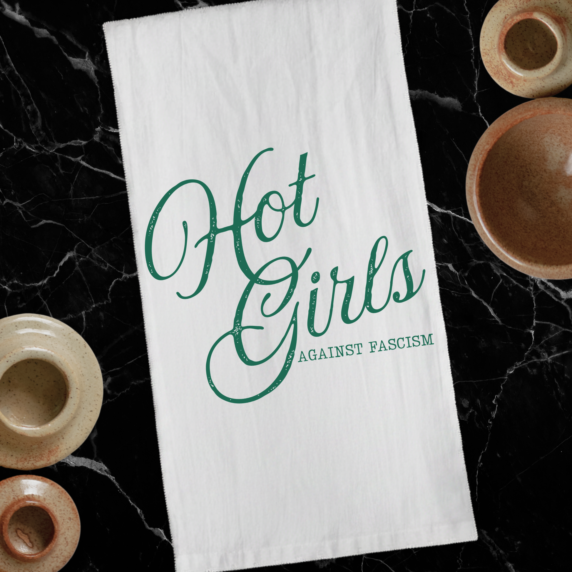 Hot Girls Against Fascism 100% cotton tea towel featuring witty feminist political humor for kitchen decor, housewarming gifts, and everyday use.