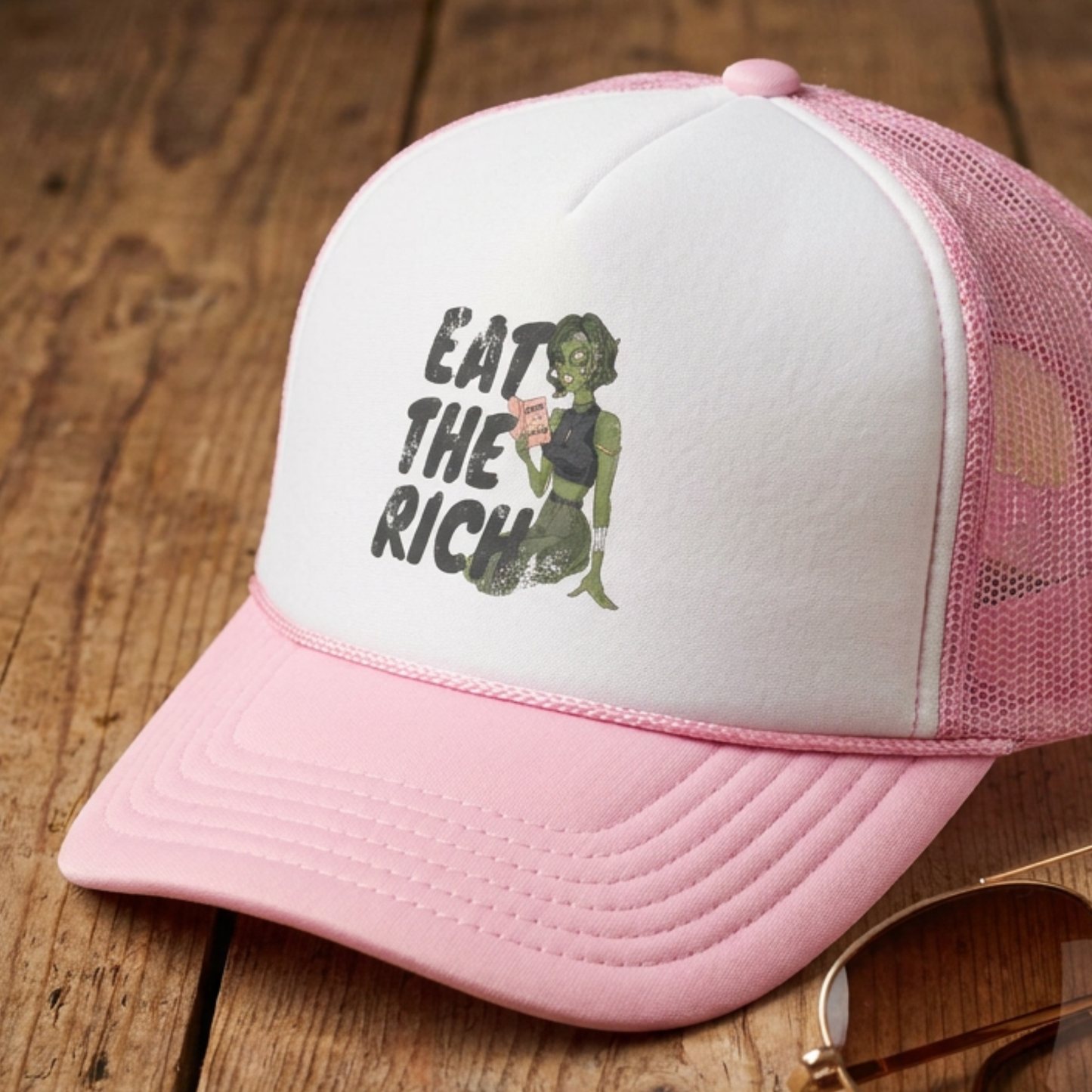 Eat the Rich zombie feminist foam trucker hat with retro horror artwork, mesh back, and dark political satire for Halloween and spooky season.