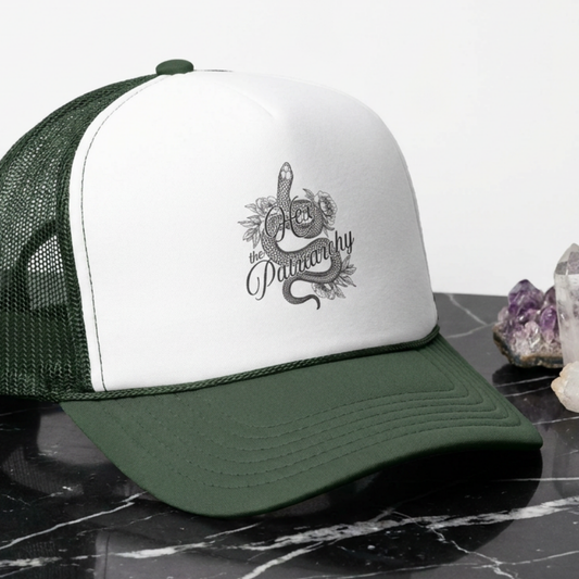 Hex the Patriarchy snake trucker hat featuring feminist witchy artwork, classic mesh-back styling, and symbolic snake design.