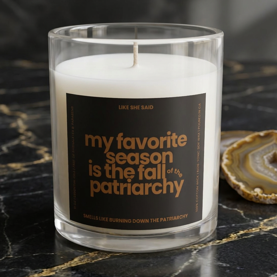My Favorite Season Is the Fall of the Patriarchy scented candle featuring funny feminist fall artwork for cozy autumn decor and feminist gifts.