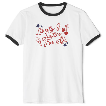 A white ringer t-shirt with black trim on the collar and sleeves, featuring a red and blue graphic on the chest that reads 'Liberty & Justice For All' with stars, cherries, and a torch.