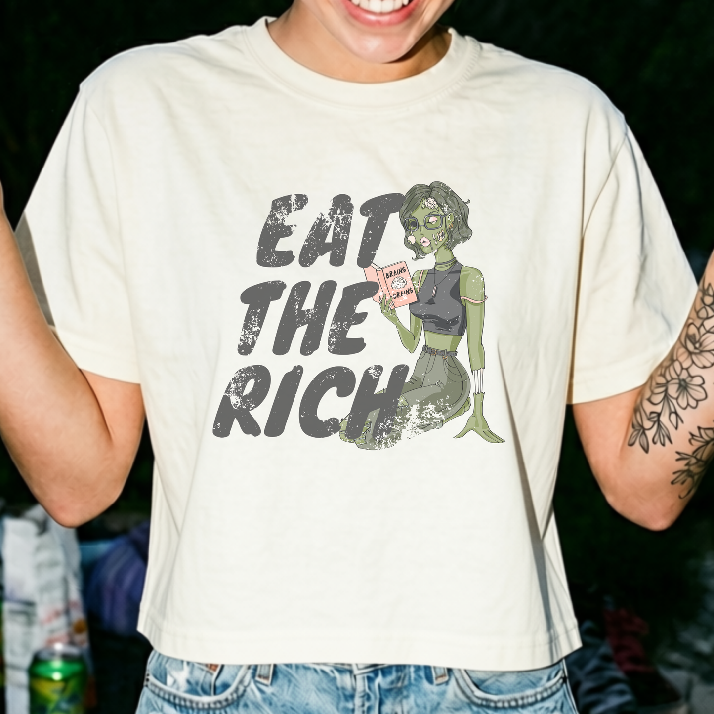 Eat the Rich feminist Halloween crop top featuring zombie artwork, a spooky political satire graphic, and vintage-inspired boxy fit.