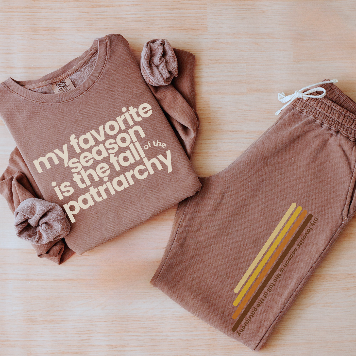 My Favorite Season Is the Fall of the Patriarchy sweatshirt featuring funny feminist fall artwork on a cozy graphic crewneck for autumn style.